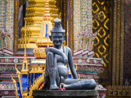 Preview: sitting figure on a stone capital in the Grand Palace, Bangkok