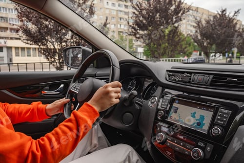 Preview: view from inside of the car woman hand on steering wheel