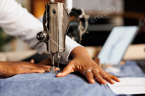 Preview: Close up of seamstress sewing machine