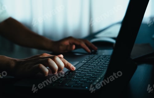 Preview: working late on laptop at home