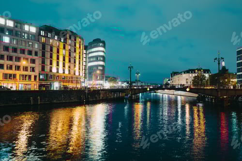Preview: Night view to historic busy street, bridge under river Spree. Long exposure, traffic
