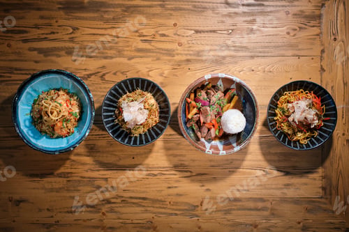 Preview: Appetizing dishes served in bowls on wooden table