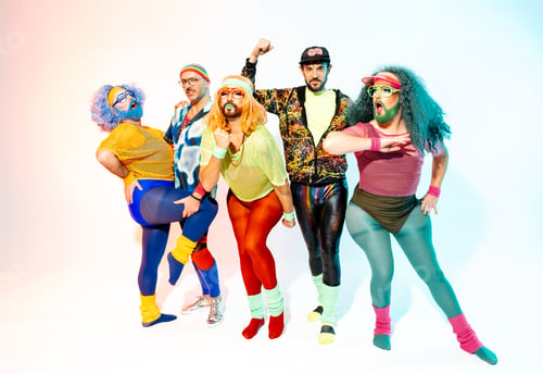 Preview: Eclectic Group of Drag Queens and Gay Friends in Colorful Retro Attire Posing With Flair