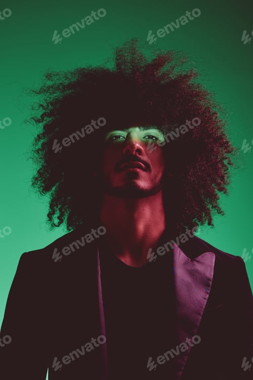 Preview: Portrait of a stylish man in a jacket on a green background multinational, color light, trend