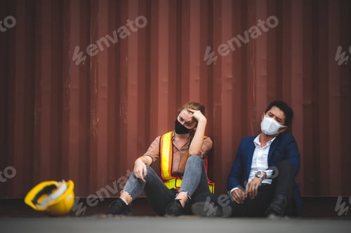 Preview: economy crisis effect, sad unemployed sitting hopelessly with a container background