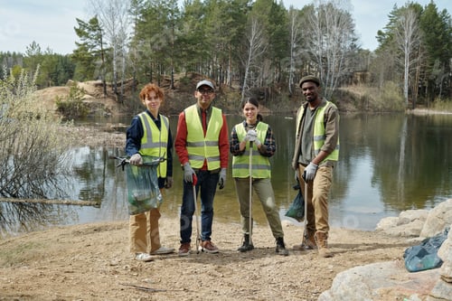Preview: Diverse Young Adults Collecting Trash near Lake during Environmental Cleanup
