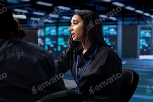 Preview: Computer scientist and coworker safeguarding data center hardware