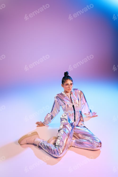 Preview: Stylish woman showcases vibrant holographic fashion in a futuristic setting