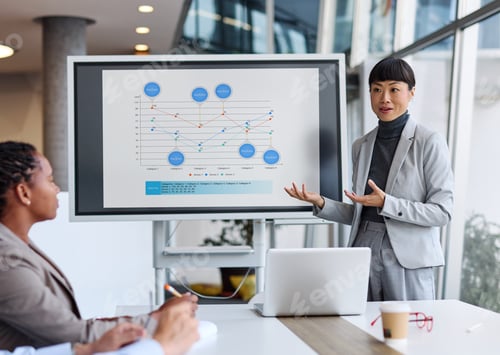 Preview: Group of young business people having a meeting in the office