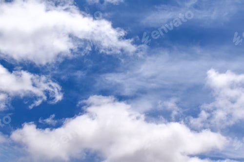 Preview: Blue sky with white fluffy clouds. Cumulus clouds background.