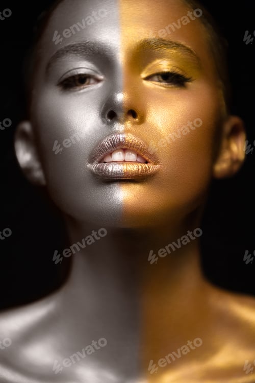 Preview: Beautyful girl with gold glitter on her face.Art image beauty face.
