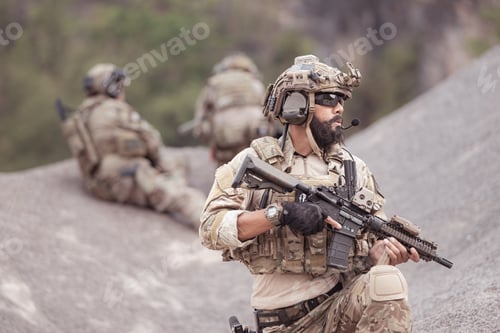 Preview: Soldiers in camouflage military uniforms carrying weapons Reconnaissance missions in rugged mountain