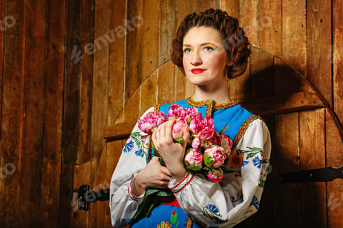 Preview: Girl Holding Flowers In Her Hands Wearing National Costume