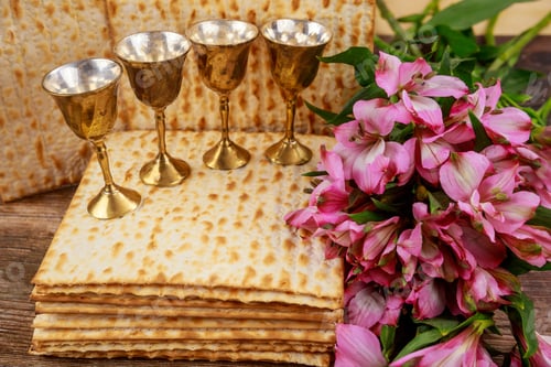 Preview: Four cups full of wine with matzah. Jewish holidays Passover concept.