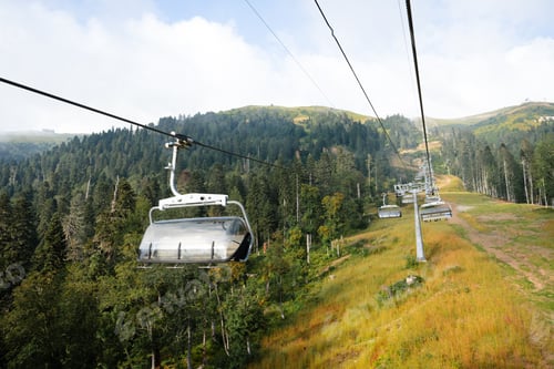 Preview: Chairlift in ski mountain resort at summer time