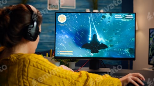 Preview: Gamer trying to relax playing space shooter online videogame