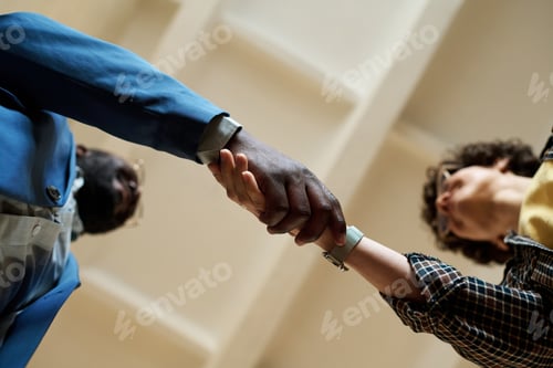 Preview: Business colleagues shaking hands at meeting