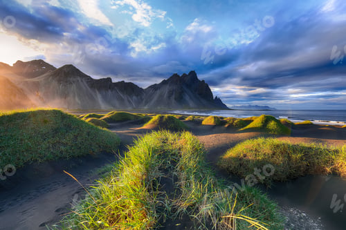 Preview: Fantastic sunny day and gorgeous black sand dunes on Stokksnes cape in Iceland.