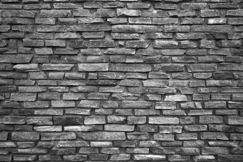 Preview: Rough stone wall made of ceramic tiles of different sizes.