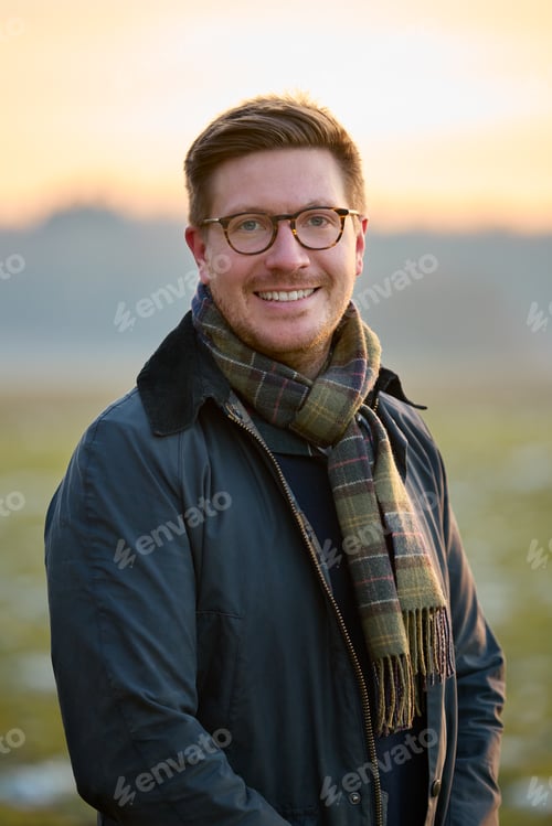 Preview: Portrait Of Smiling Man On Snowy Walk In Winter Countryside