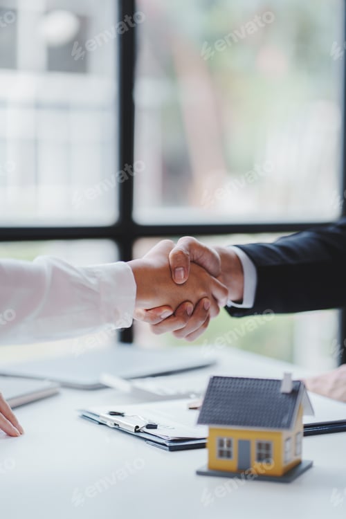 Preview: Handshake real estate agents deliver sample homes to customers. mortgage loan agreement Make a contr