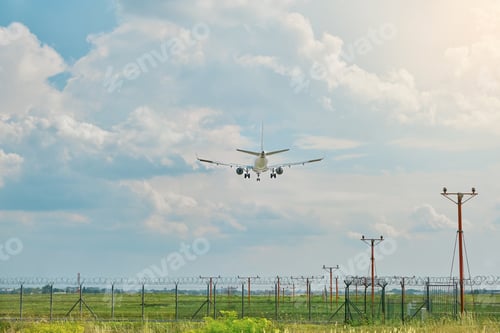Preview: Passenger airplane landing on airport runway during on sunny day. Travel background. Business