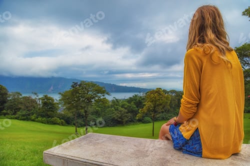 Preview: Lonesome Girl Sitting On A Bench And Looking At The Nature Landscape.
