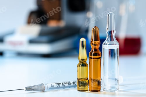 Preview: Vial of vaccine bottle with a syringe close up