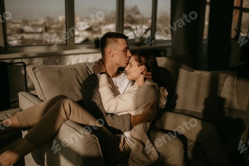Preview: Loving Couple Embracing in the Warm Sunlight