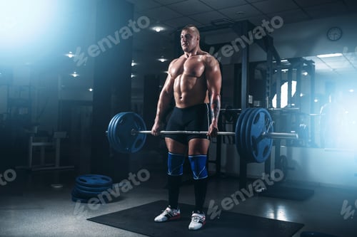 Preview: Strong athlete exercise with weight in fit gym