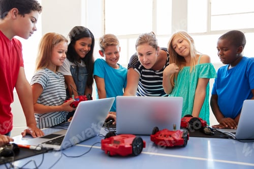 Preview: Group Of Students In After School Computer Coding Class Learning To Program Robot Vehicle