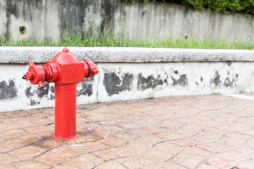 Preview: Red fire hydrant at busy walk pavement ready for emergency