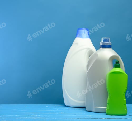Preview: Plastic bottles with detergents on blue background