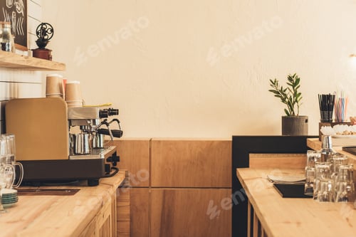 Preview: coffee machine, glassware and paper cups in coffee shop