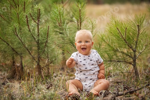 Preview: Portrait Of A Baby Boy In Green Pine Forest