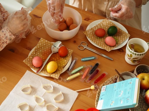 Preview: Female hands holding colored Easter eggs. Easter. Trappings