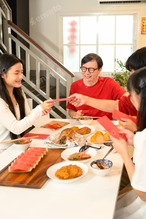 Preview: Family handing red envelop during Chinese New Year.