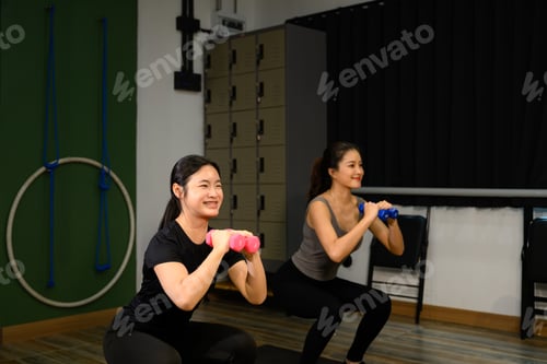 Preview: Women practicing strength training with dumbbells, focusing on lower body and core