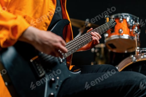 Preview: rock performer with electric guitar in recording studio recording playing track