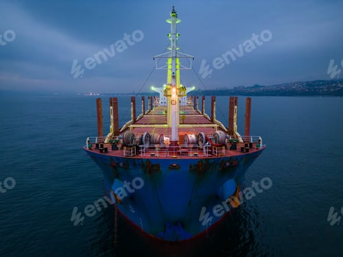 Preview: Aerial view cargo bulk carrier ship on the sea at night