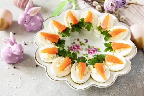 Preview: Festive dinner, Easter brunch. Stuffed eggs with cheese and salted salmon in the form of a carrot.