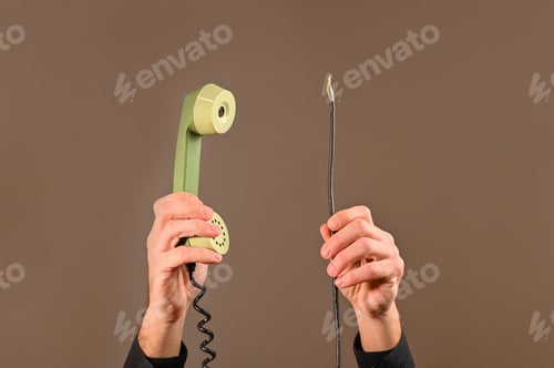Preview: handset in hand and dangling wires