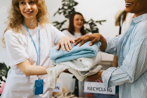 Preview: young people are engaged in charity and volunteering, select clothes for recycling