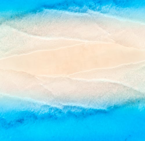 Preview: Aerial view of blue sea on the both sides empty sandy beach