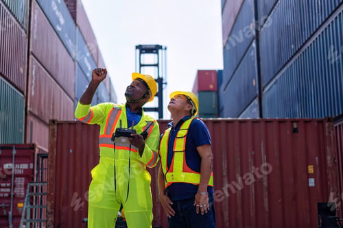 Preview: Engineer working in container storage yard fly drone looking top view check container arrangement