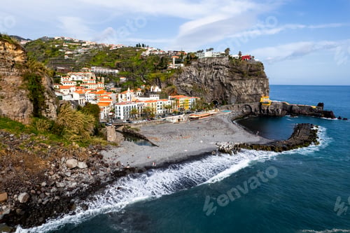 Preview: Ponta do Sol in Madeira Island, Portugal. Aerial drone view at cityscape of coastal town and beach