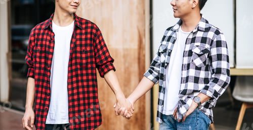 Preview: Two men who love each other stand hand in hand.