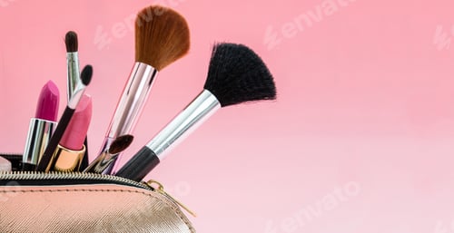 Preview: Make-up cosmetic products bag against pink background, copy space