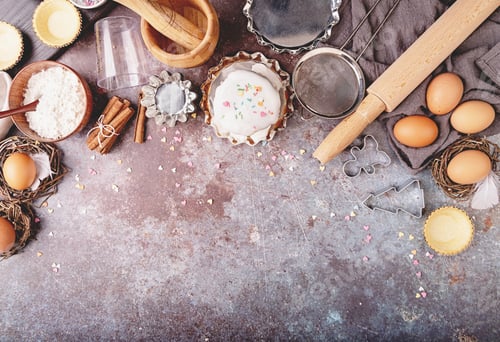Preview: baking ingredients for a cake top view on dark rough background