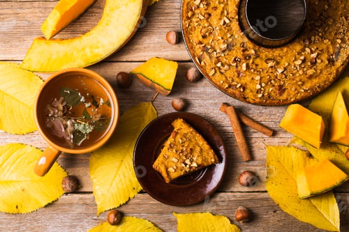 Preview: Autumn Composition with Pumpkin Pie and Tea